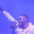 Frank ocean in white outfit with purple lights 