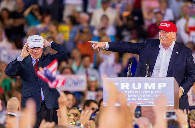 Jeff Sessions and Donald Trump on stage at rally.