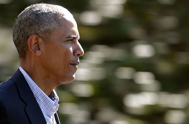 U.S. President Barack Obama walks out of the White House before boarding Marine One and departing to Louisiana August 23, 2016, in Washington, DC. Obama will survey historic flooding that has damaged more almost 70,000 homes and killed at least 13 people.