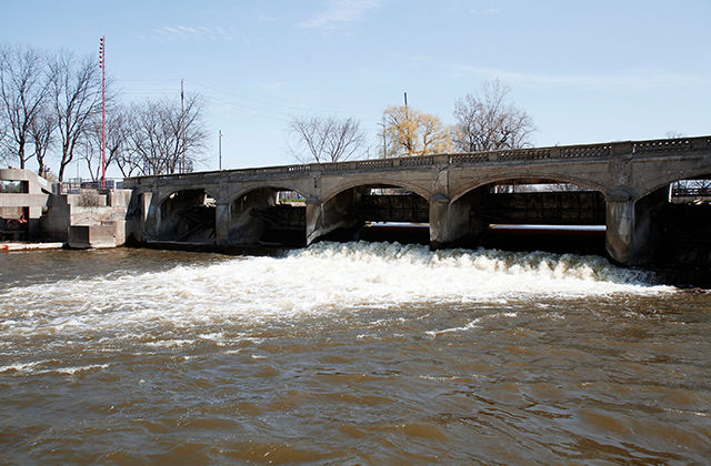 The Flint River is shown in downtown Flint April 20, 2016, in Flint, Michigan. The switch to Flint River from the Great Lakes Water Authority ultimately led to the water crisis. Now, officials want the city to stay with the water authority.