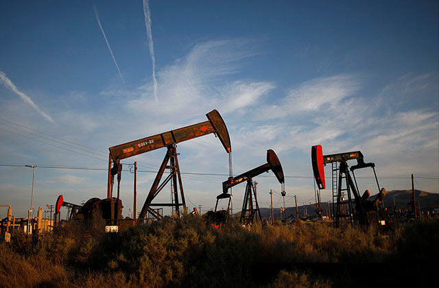 Pump jacks and wells are seen in an oil field on the Monterey Shale formation where gas and oil extraction using hydraulic fracturing, or fracking, is on the verge of a boom on March 23, 2014, near McKittrick, California.