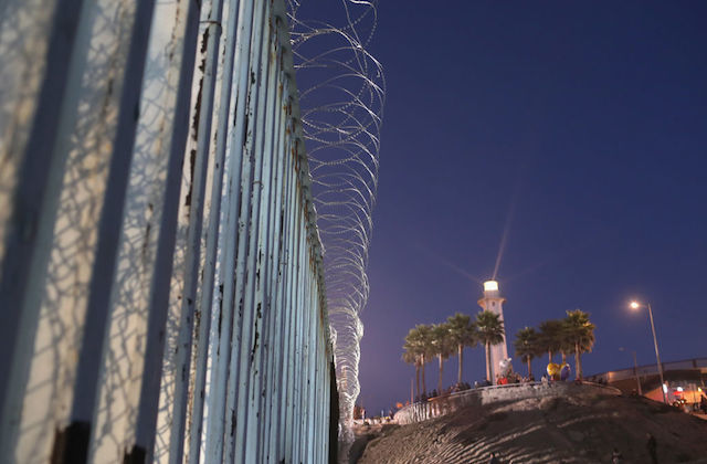 A Mexican lighthouse shines above the U.S.-Mexico border fence in San Diego, CA, as seen from Tijuana, Mexico on November 16, 2018.