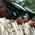 Marines, heads bowed