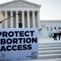 U.S. Supreme Court and protest sign supporting abortion