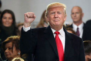 President Donald Trump waves to the crowd from the inaugural parade in front of the White House on January 20, 2017, in Washington, D.C.