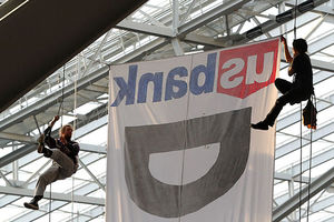 Two protestors hang suspended from ropes above the Minnesota Vikings and Chicago Bears football game on January 1, 2017, at U.S. Bank Stadium in Minneapolis, Minnesota. The protesters unfurled a banner in opposition to the Dakota Access Pipeline.