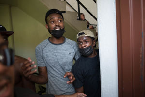 Two Black men scream for help.